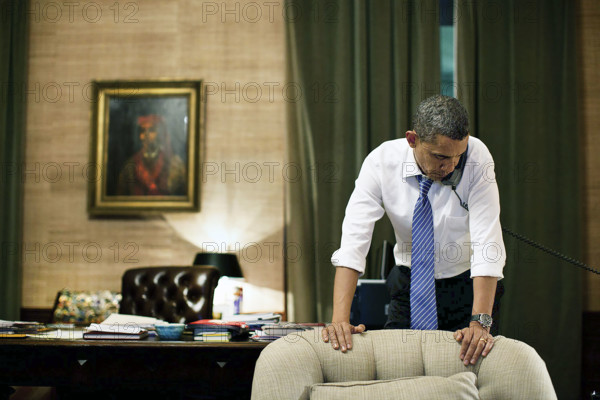 U.S. President Barack Obama talking on telephone with President Lee Myung-bak of South Korea in White House Treaty Room Office, Washington D.C., USA, Pete Souza, Office of White House Photography, November 23, 2010