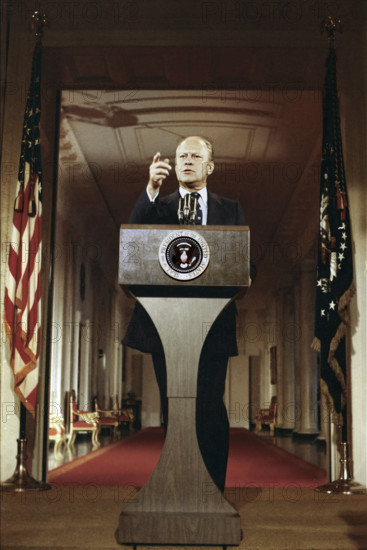 U.S. President Gerald R. Ford standing at lectern during first press conference, White House East Room, Washington, D.C., USA, Gerald R. Ford White House Photographs, August 28, 1974