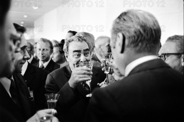 U.S. President Gerald R. Ford and Soviet General Secretary Leonid Brezhnev raising their glasses in a toast following signing of the final act of the Conference on Security and Cooperation in Europe (CSCE), Helsinki, Finland, Gerald R. Ford White House Photographs, August 1, 1975