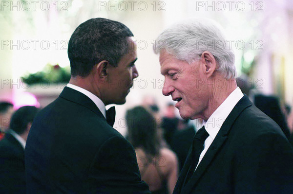 U.S. President Barack Obama talking with former U.S. President Bill Clinton during State Dinner in the White House State Dining Room, Washington, D.C., USA, Pete Souza, Office of White House Photography Office, January 19, 2011