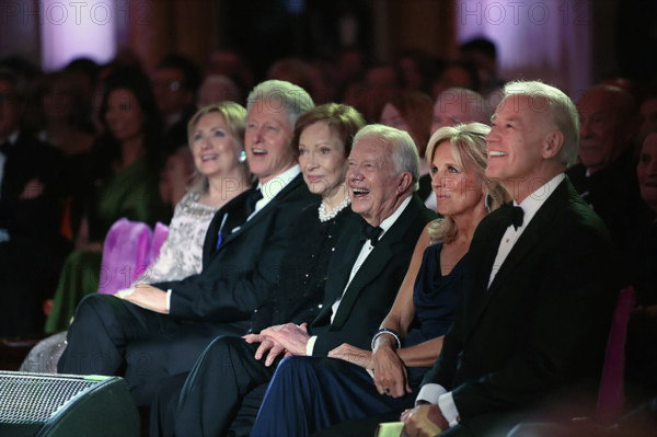 U.S. Secretary of State Hillary Rodham Clinton, former U.S. President Bill Clinton, former U.S. First Lady Rosalynn Carter, former U.S. President Jimmy Carter, Dr. Jill Biden, and U.S. Vice President Joseph Biden listening to entertainment at State Dinner in the White House East Room, Washington, D.C., USA, Pete Souza, Office of White House Photography Office, January 19, 2011