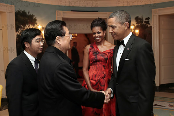 U.S. President Barack Obama and U.S. First Lady Michelle Obama saying goodbye to President Hu Jintao of China in the White House Diplomatic Reception Room at conclusion of State Dinner, Washington, D.C., USA, Pete Souza, Office of White House Photography Office, January 19, 2011