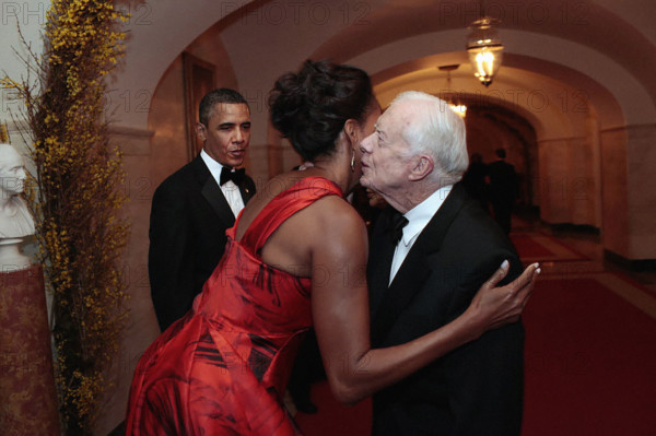 U.S. President Barack Obama and U.S. First Lady Michelle Obama saying goodbye to former U.S. President Jimmy Carter in the White House Lower Cross Hall at conclusion of State Dinner, Washington, D.C., USA, Pete Souza, Office of White House Photography Office, January 19, 2011