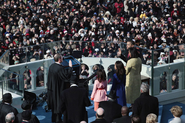 Barack Obama being sworn-in as U.S. President by U.S. Supreme Court Chief Justice John Roberts, as Michelle Obama, Sasha Obama and Malia Obama look on, U.S. Capitol, Washington, D.C., USA, Pete Souza, Office of White House Photography Office, January 20, 2009