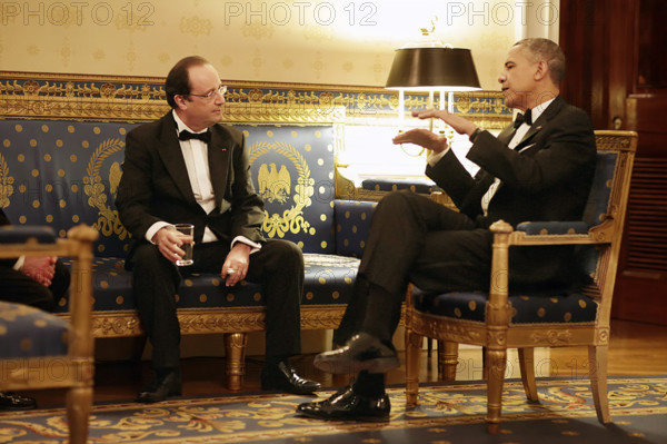 U.S. President Barack Obama talking with President François Hollande of France in White House Blue Room before State Dinner, Washington, D.C., Pete Souza, Office of White House Photography Office, USA, February 11, 2014