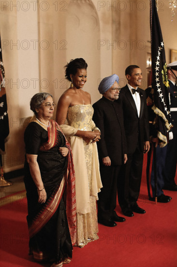 U.S. President Barack Obama, U.S. First Lady Michelle Obama, Prime Minister Manmohan Singh of India and his wife, Mrs. Gursharan Kaur, line up in the White House Cross Hall to pose for an official photo before State Dinner, Washington, D.C., USA, Pete Souza, Office of White House Photography Office, November 24, 2009
