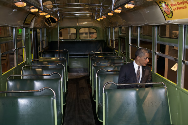 U.S. President Barack Obama sitting on the famed Rosa Parks bus, Henry Ford Museum, Dearborn, Michigan, USA, Pete Souza, Office of White House Photography, April 18, 2012