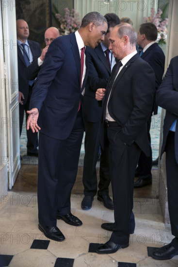 U.S. President Barack Obama talking with President Vladimir Putin of the Russian Federation, after a lunch with other foreign leaders to commemorate the 70th anniversary of D-Day, Château de Bénouville, Bénouville, Normandy, France, Pete Souza, Office of White House Photography, June 6, 2014