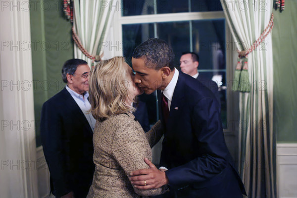 U.S. President Barack Obama kissing U.S. Secretary of State Hillary Rodham Clinton in the White House Green Room following his statement detailing the mission against Osama bin Laden, Washington, D.C., USA, President Barack Obama shakes hands with Secretary of State Hillary Rodham Clinton in the Green Room of the White House following his statement detailing the mission against Osama bin Laden, May 1, 2011