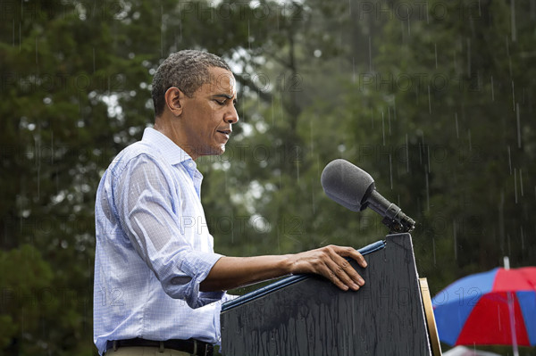 U.S. President Barack Obama delivering remarks in rain at grassroots campaign event, Walkerton Tavern & Gardens, Glen Allen, Virginia, USA, Pete Souza, Office of White House Photography, July 14, 2012