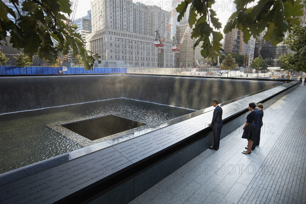 U.S. President Barack Obama and U.S. First Lady Michelle Obama, along with former U.S. President George W. Bush and former U.S. First Lady Laura Bush, pause at North Memorial Pool of the National September 11 Memorial on tenth anniversary of the 9/11 attacks against the United States, Manhattan, New York City, New York, USA,  Chuck Kennedy, Office of White House Photography, September 11, 2011