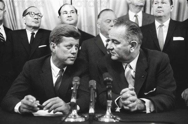 U.S. Senator John Kennedy and democratic nominee for U.S. President, and U.S. Senator Lyndon B. Johnson and democratic nominee for U.S. Vice President, seated at table with microphones in Special Session of Congress. Washington, D.C., USA, Thomas J. O'Halloran, U.S. News & World Report Magazine Photograph Collection