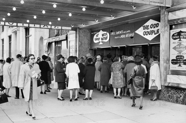 Group of people at entrance to theater to see pre-Broadway production of Neil Simon's play "The Odd Couple", directed by Mike Nichols and starring Walter Matthau and Art Carney,  National Theatre, Washington, D.C., USA, Marion S. Trikosko, U.S. News & World Report Magazine Photograph Collection, March 3, 1965