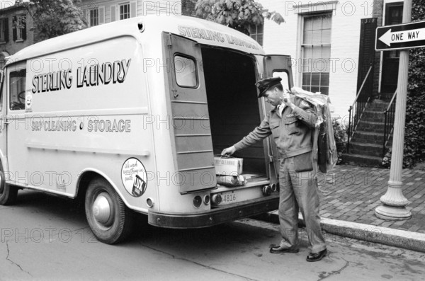 Laundry man from Sterling Laundry, making deliveries with a truck to homes, Washington, D.C., USA, Thomas J. O'Halloran, U.S. News & World Report Magazine Photograph Collection, May 6, 1958