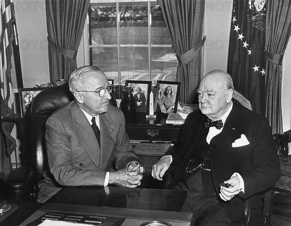 U.S. President Harry S. Truman and Winston Churchill, Prime Minister of Great Britain, sit down in Oval Office to begin their formal White House conferences, Washington, D.C., USA, Abbie Rowe, National Parks Service, Harry S. Truman Library, January 7, 1952