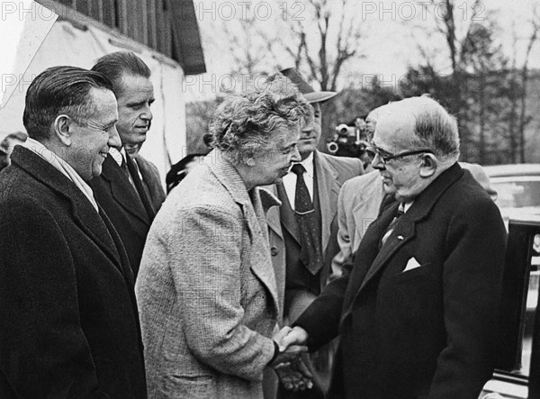 Former U.S. First Lady Eleanor Roosevelt (foreground, center) saying goodbye to French President Vincent Auriol (foreground, right) after his tour of the Roosevelt estate. Also pictured: Secretary of the Interior Oscar Chapman (foreground, left); and Elliott Roosevelt (background, left), Hyde Park, New York, USA, Abbie Rowe, National Parks Service, Harry S. Truman Library, April 4, 1951