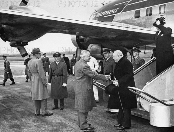 U.S. President Harry S. Truman greeting British Prime Minister Winston (with British Foreign Minister Anthony Eden on steps) after Churchill arrived at Washington National Airport on board President Truman's airplane, "The Independence", Washington, D.C., USA, Abbie Rowe, National Parks Service, Harry S. Truman Library, January 5, 1952