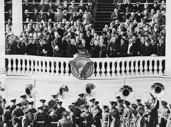 U.S. President Harry S. Truman (center foreground, right) taking oath of office and is sworn in as U.S. President by Chief Justice of the Supreme Court, Fred Vinson, U.S. Capitol building, Washington, D.C., USA, Abbie Rowe, National Parks Service, Harry S. Truman Library, January 20, 1949