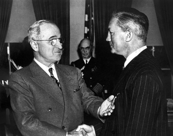 U.S. President Harry S. Truman congratulating U.S. Defense Secretary James Forrestal after awarding him the Medal of Merit at White House ceremony, Washington, D.C., USA, Abbie Rowe, National Parks Service, Harry S. Truman Library, January 27, 1948