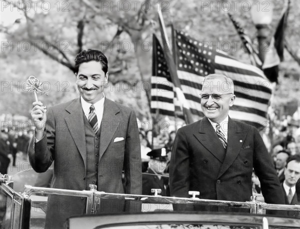 President Miguel Aleman of Mexico (left) holding ceremonial key to city while  U.S. President Harry S. Truman (right) looks on during visit, Washington, D. C, USA, Abbie Rowe, National Parks Service, Harry S. Truman Library, April 29, 1947
