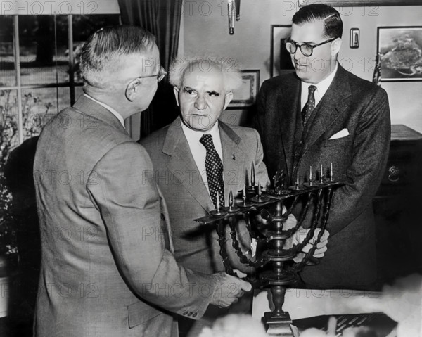 U.S. President Harry S. Truman receiving a gift of a menorah from Israel Prime Minister David Ben-Gurion and Israel Ambassador to the U.S. Abba Eban, Washington, D.C., USA, Abbie Rowe, National Parks Service, Harry S. Truman Library, May 8, 1951