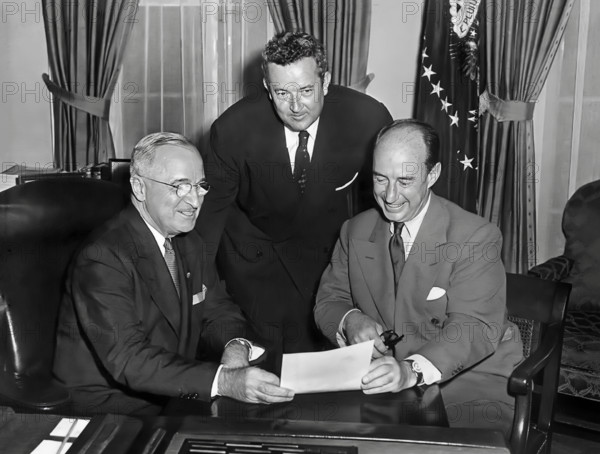 U.S. President Harry S. Truman (left) meeting with Governor Adlai Stevenson of Illinois (right) and Senator John J. Sparkman of Alabama (center) in White House Oval Office after accepting the Democratic nominations for President and Vice President, Washington, D.C., USA, Abbie Rowe, National Parks Service, Harry S. Truman Library, August 12, 1952