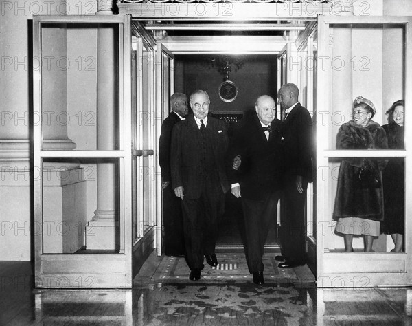 U.S. President Harry S. Truman (left) and British Prime Minister Winston Churchill (right) smile as they step outside of White House during the Prime Minister's visit, Washington, D.C., USA, Abbie Rowe, National Parks Service, Harry S. Truman Library, January 8, 1953