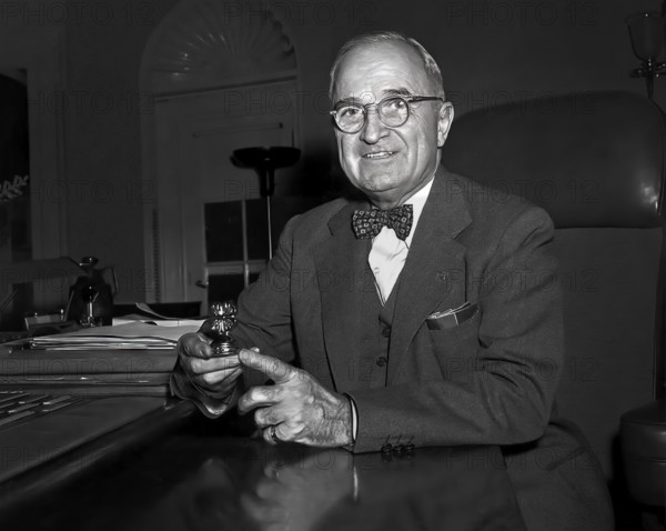 U.S. President Harry S. Truman sitting at his desk with paperweight, a gift to him from a 4-H group, White House Oval Office, Washington, D.C., USA, Abbie Rowe, National Parks Service, Harry S. Truman Library, January 8, 1953