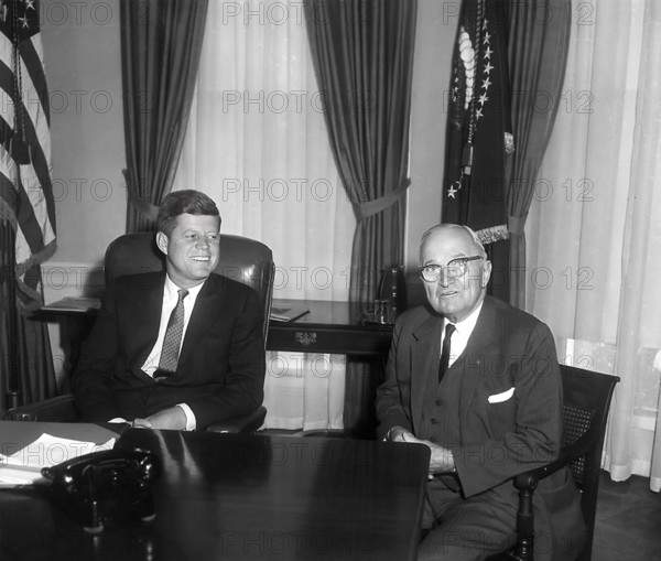 U.S. President John F. Kennedy (left) talking with former U.S. President Harry S. Truman (right) in White House Oval Office on Kennedy's first full day in office, Washington, D.C., USA, Abbie Rowe, National Parks Service, Harry S. Truman Library, January 21, 1961
