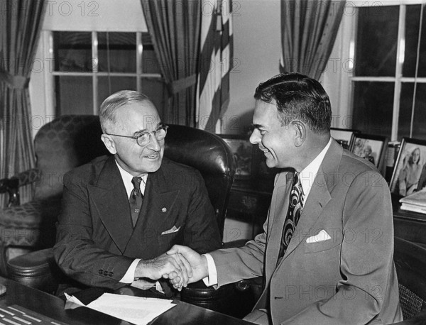 U.S. President Harry S. Truman (left) meeting with New York Governor Thomas E. Dewey in White House Oval Office, Washington, D.C., USA, Abbie Rowe, National Parks Service, Harry S. Truman Library, September 13, 1951