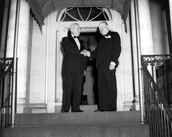 U.S. President Harry S. Truman (left) and British Prime Minister Winston Churchill (right) shaking hands outside Blair House, Washington, D.C., USA, Abbie Rowe, National Parks Service, Harry S. Truman Library, March 24, 1949
