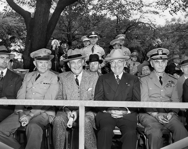 U.S. President Harry S. Truman (first row, 2nd right) with Secretary of the Army Frank Pace (first row left), General Dwight D. Eisenhower (first row 2nd left), Secretary of Defense Louis Johnson (first row, center), and Admiral William Leahy (first row, right) on the reviewing stand during inaugural Armed Forces Day parade, Washington, D.C., USA, Abbie Rowe, National Parks Service, Harry S. Truman Library, May 20, 1950