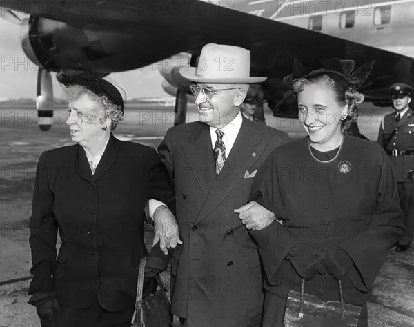 U.S. President Harry S. Truman (center) standing with U.S. First Lady Bess W. Truman (left) and their daughter, Margaret (right), at Washington National Airport prior to the President's departure, Washington, D.C., USA, Abbie Rowe, National Parks Service, Harry S. Truman Library, November 4, 1950