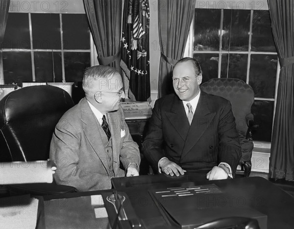 U.S. President Harry S. Truman (left) at his desk with Crown Prince Olav of Norway (right) in the White House Oval Office, Washington, D.C., USA, Abbie Rowe, National Parks Service, Harry S. Truman Library, November 20, 1950