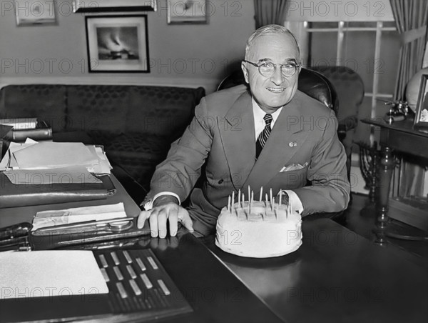 U.S. President Harry S. Truman receiving a cake for his 67th birthday, White House Oval Office, Washington, D.C., USA, Abbie Rowe, National Parks Service, Harry S. Truman Library, May 8, 1951