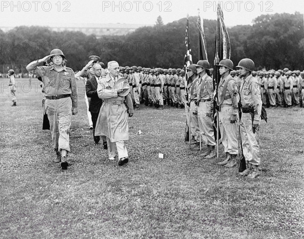 Four Nisei soldiers present the colors as U.S. President Harry S. Truman reviews 442nd Regimental Combat Team, all second-generation Japanese-Americans, on the Ellipse, Washington, D.C., USA, Abbie Rowe, National Parks Service, Harry S. Truman Library, July 15, 1946