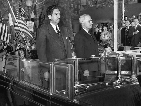 Mexican President Miguel Aleman (left) and U.S. President Harry S. Truman (right) standing in back of an open limousine during welcoming ceremonies in Aleman's honor, Washington, D.C., USA, Abbie Rowe, National Parks Service, Harry S. Truman Library, April 29, 1947