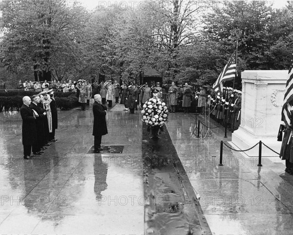 U.S. President Harry S. Truman standing before Tomb of the Unknown Soldier, Arlington National Cemetery. Standing behind President Truman are, from left to right: Admiral William D. Leahy; Secretary of Defense James Forrestal; Under Secretary of the Navy John L. Sullivan; Major General Harry Vaughan; and Captain James Foskett, President Truman's Naval Aide, Arlington National Cemetery, Arlington, Virginia, USA, Abbie Rowe, National Parks Service, Harry S. Truman Library, November 11, 1947