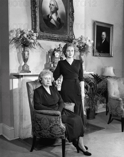 U.S. First Lady Bess Truman (left) posing with her daughter, Margaret (right), in front of fireplace at Blair House, Washington, D.C., USA, Abbie Rowe, National Parks Service, Harry S. Truman Library, December 14, 1948