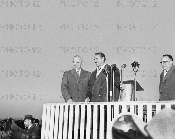 U.S. President Harry S. Truman (left) and President Carlos Prio Socarras of Cuba (second from left) on platform upon President Prio Socarras' arrival at National Airport, Washington, D.C., USA, Abbie Rowe, National Parks Service, Harry S. Truman Library, December 8, 1948