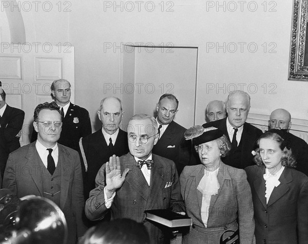 U.S. Vice President Harry S. Truman taking oath of office, at 7:09 p.m., after death of U.S. President Franklin D. Roosevelt, as Truman's wife Bess and daughter Margaret look on, Washington, D.C., USA, Abbie Rowe, National Parks Service, Harry S. Truman Library, April 12, 1945