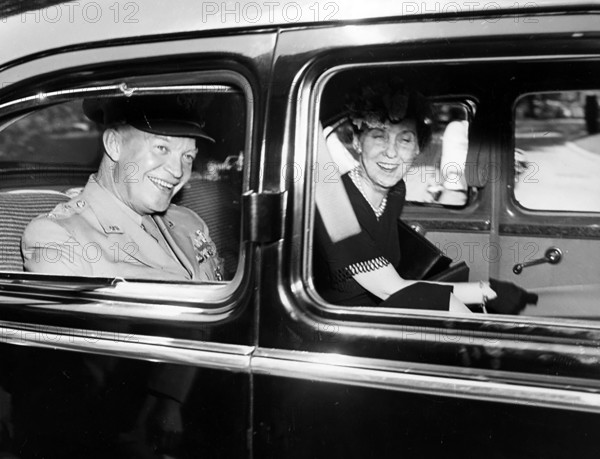 U.S. General Dwight D. Eisenhower and his wife Mamie Eisenhower smiling in back of limousine after General received Distinguished Service Medal, Washington, D.C., USA, Abbie Rowe, National Parks Service, Harry S. Truman Library, June 18, 1945