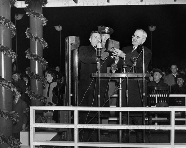 U.S. President Harry S. Truman pressing button to light the National Christmas Tree, Washington, D.C., USA, Abbie Rowe, National Parks Service, Harry S. Truman Library, December 24, 1945