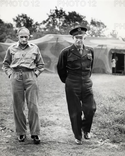 British Field Marshal Bernard L. Montgomery (left) briefing U.S. General Dwight D. Eisenhower (right) on new attacks launched against the Germans, Normandy, France, U.S. Army Signal Corps, July 26, 1944