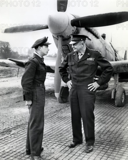 U.S. General Dwight D. Eisenhower talking to flight officer A. K. Asbos, Brisbane, Australia, in France, when the General made trip there by plane to get on-the-spot-reports of the new offensive against the Germans, Normandy, France, U.S. Army Signal Corps, July 26, 1944
