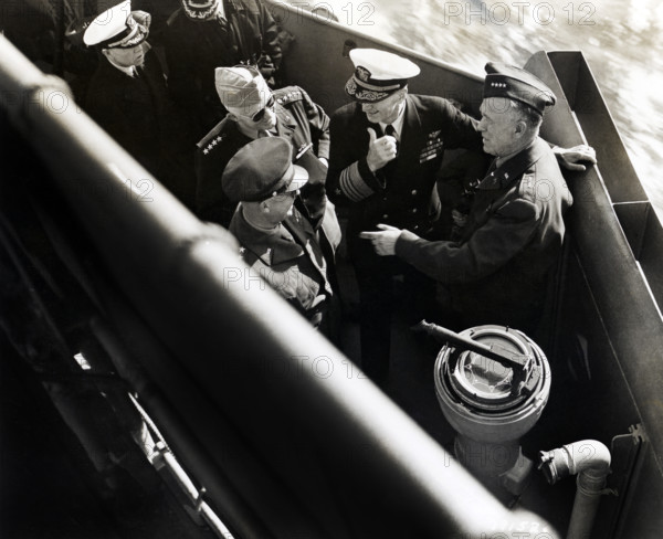 U.S. General Dwight D. Eisenhower, U.S. General Henry Arnold, U.S. Admiral Ernest King and U.S. General George Marshall, America's top-ranking military officers in the European Theater of Operations, aboard landing craft enroute to inspect American installations, Normandy, France, U.S. Army Signal Corps, June 14, 1944