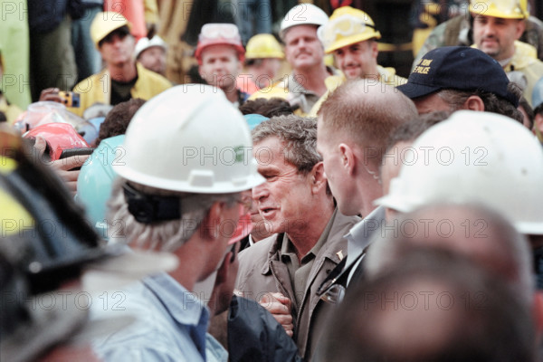 U.S. President George W. Bush greeting firefighters, police and rescue personnel at World Trade Center disaster site, Financial District, Manhattan, New York City, New York, USA, Eric Draper, George W. Bush White House Photo Office, September 14, 2001