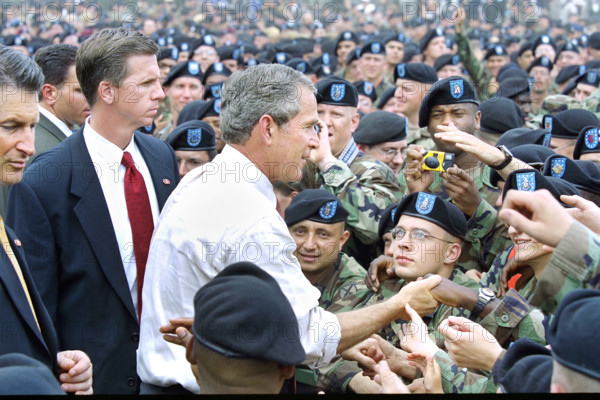 U.S. President George W. Bush greeting U.S. troops and guests after delivering remarks, Fort Drum, Le Ray, New York, USA, Tina Hager, George W. Bush White House Photo Office, July 19, 2002