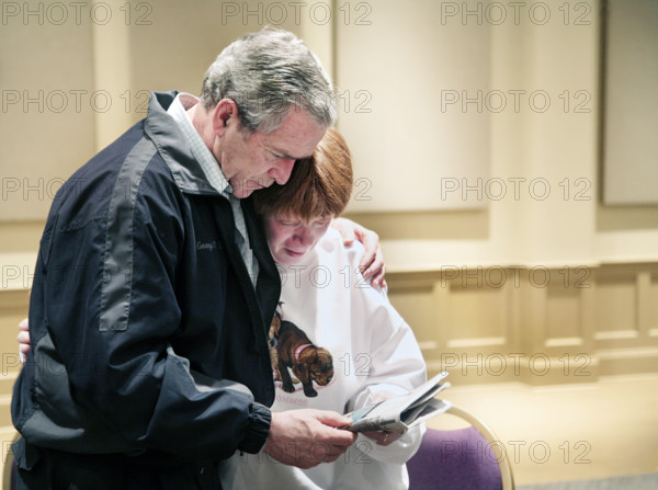 U.S. President George W. Bush meeting with tornado victim, Hillcrest Baptist Church, Enterprise, Alabama, USA, Paul Morse, George W. Bush White House Photo Office, March 3, 2007