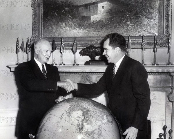 U.S. Vice President Richard M. Nixon shaking hands  while meeting with U.S. President Dwight D. Eisenhower before Nixon's departure on Far East good will tour, White House, Washington, D.C., USA, National Parks Service, Dwight D. Eisenhower Library, October 5, 1953